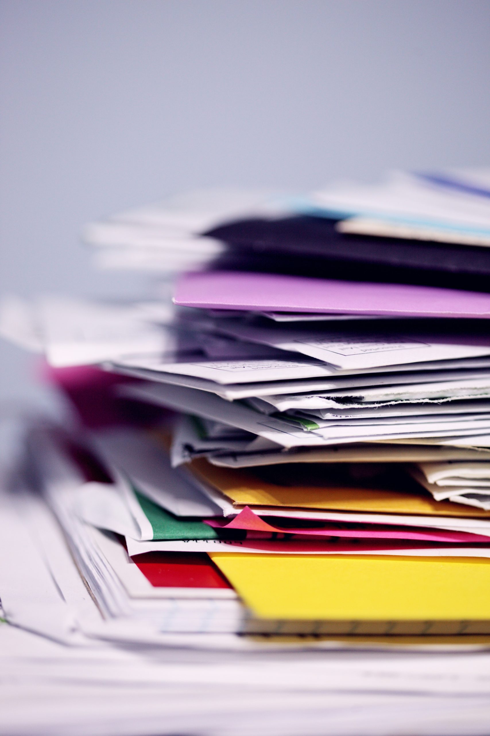 Pile of paper and files on a table